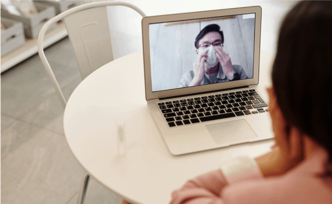 Two people on a video call during the pandemic. Their contact could be facilitated by linguists.